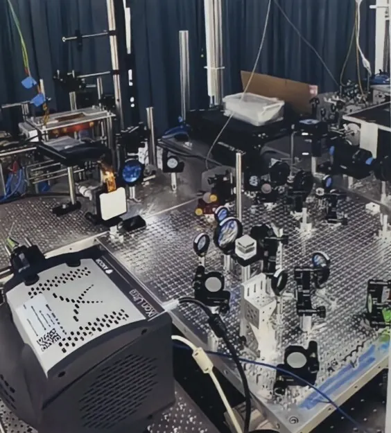 The quantum simulation experiment being assembled on an optical table in the qSIM laboratory